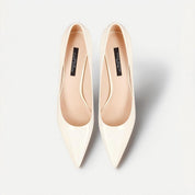 Off-white patent leather pointed-toe stiletto pumps