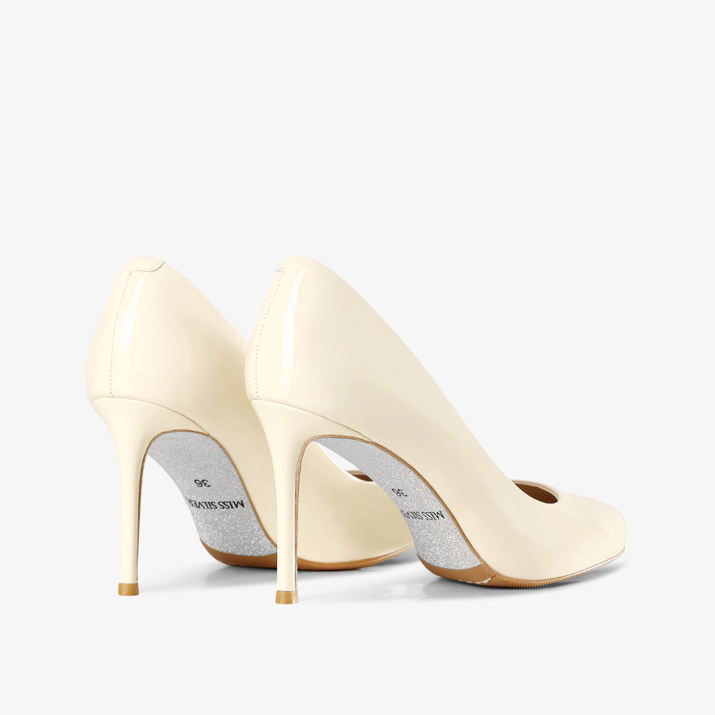 Ivory Patent Leather Stiletto Pumps