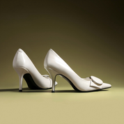Off-White Pointed-Toe Stiletto Pumps with Buckle Detail