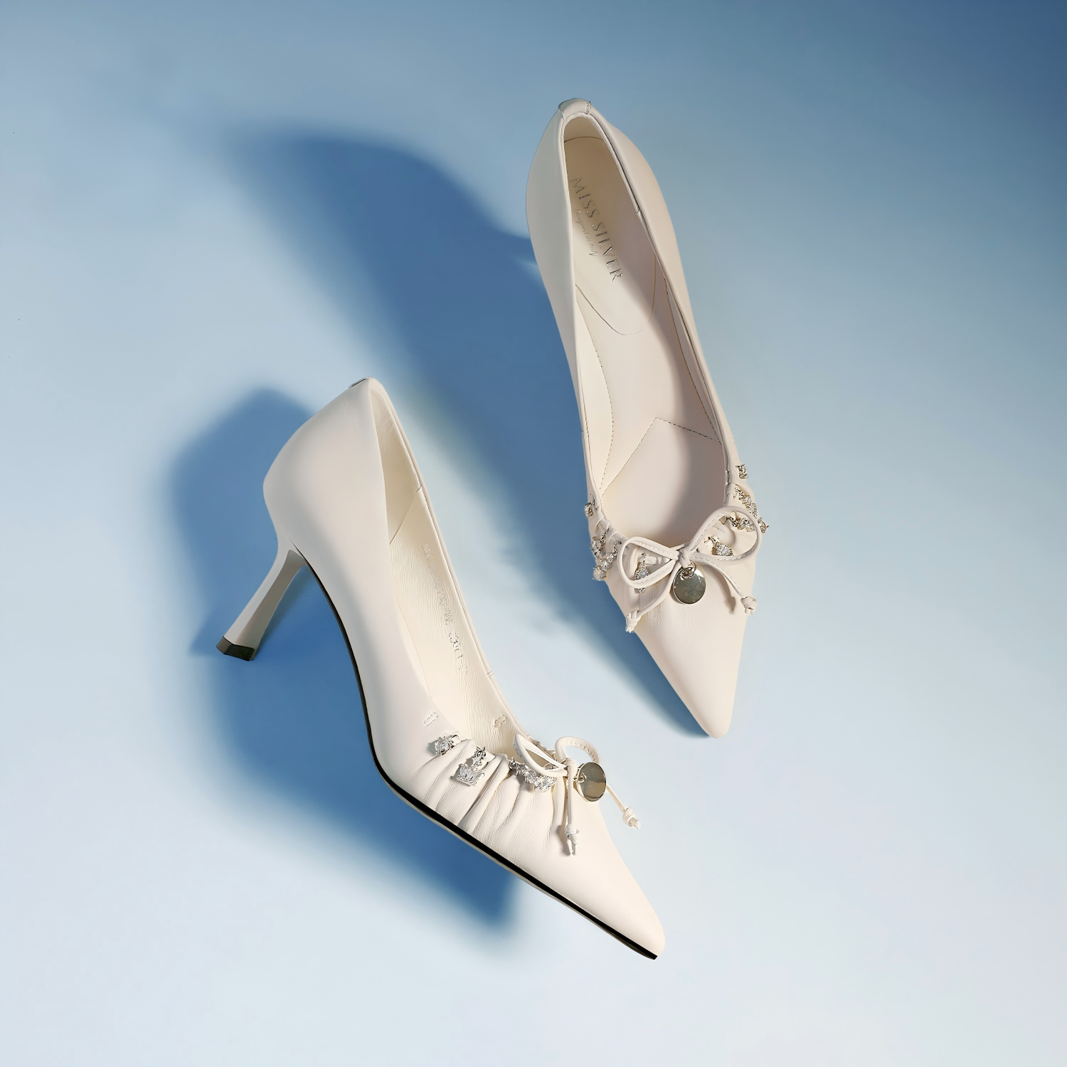 White Leather Crystal Bow Pointed Toe Bridal Pumps