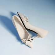 White Leather Crystal Bow Pointed Toe Bridal Pumps
